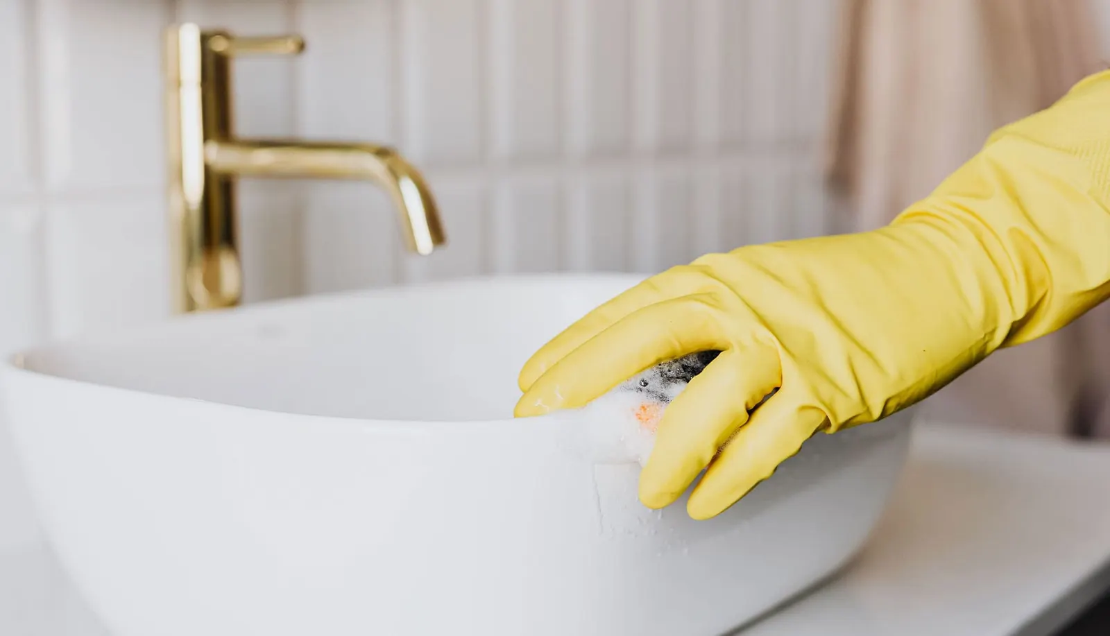 Deep cleaning a sparkling kitchen sink